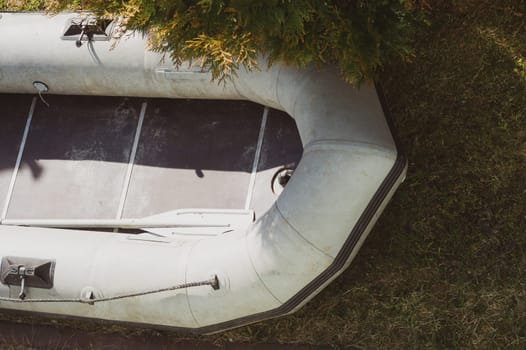 Inflatable boat on the green grass