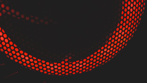 Modern abstract background with red lights. cooler of processor with color light luminous through the protective grid in the dark. futuristic design