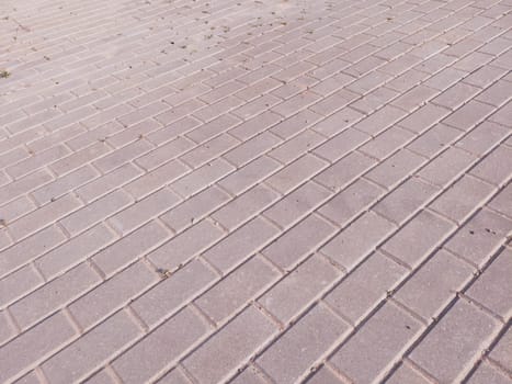 Street with brick pavement. stone sidewalk background