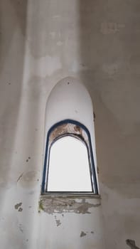 Window of abandoned church. copy space in the middle