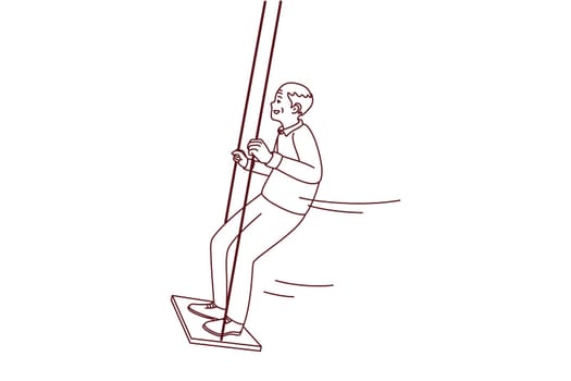 Happy active elderly grandfather swinging