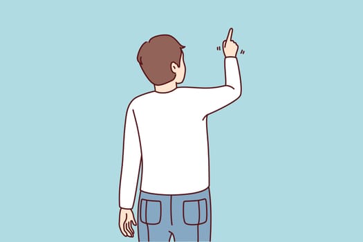 Back view of man pointing at wall with finger. Guy showing with finger on blank space. Vector illustration.