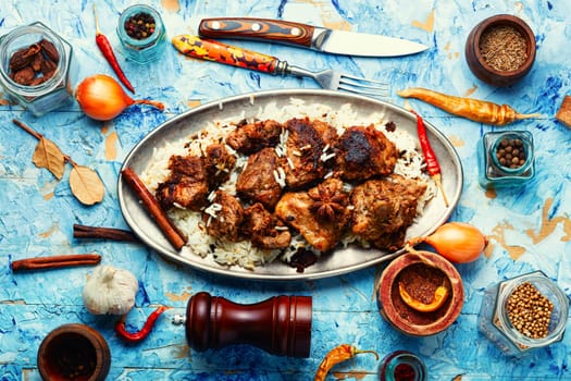 Vinegar marinated pork roast in Indian spices, vindaloo.