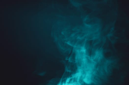 Smoke clouds in the dark abstract background. fog floating in air