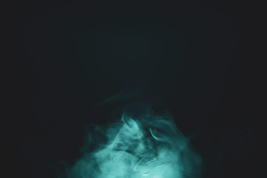 Smoke clouds in the dark abstract background. fog floating in air