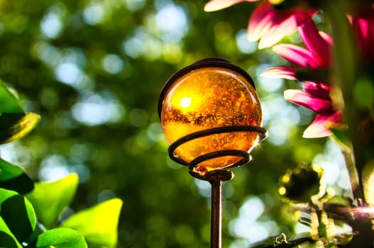 yellow glass ball in the sunlight on the balcony. sometimes the beautiful things are so near