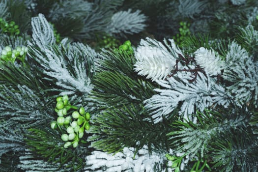 Artificial fir tree branches with needles close up. Christmas decoration