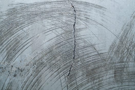 Concrete wall with cracks and scratches. abstract gray background with patterns. wall is ready for renovation works