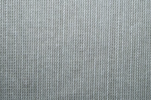 Beige knitted background. fabric texture. textile close up