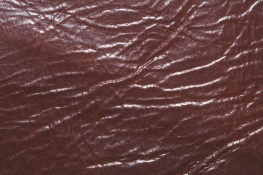 Dark brown leather with wrinkled lines close up