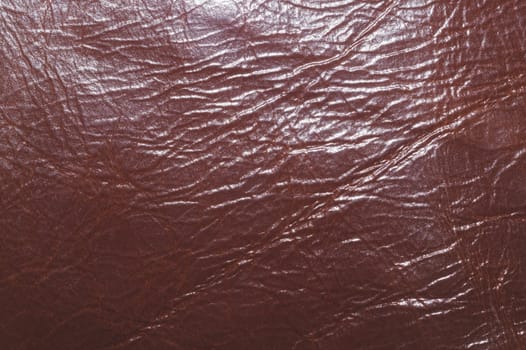 Dark brown leather with wrinkled lines close up