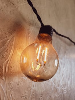 Light bulb hanging on the wall. retro style