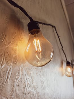 Light bulb hanging on the wall. retro style