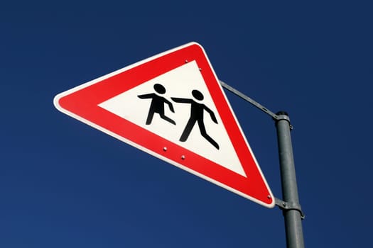 Warning sign of playing childs near a school