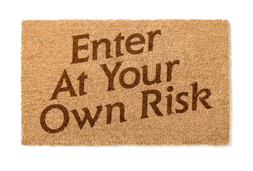 Enter At Your Own Risk Welcome Mat Isolated On A White Background.