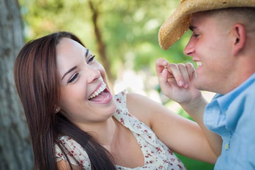 Happy Romantic Caucasian Couple Talking in the Park.