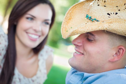 Happy Romantic Caucasian Couple Talking in the Park.