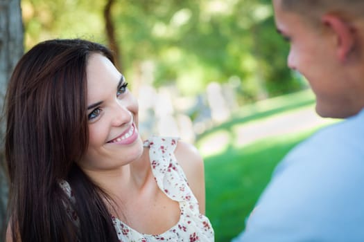 Happy Romantic Caucasian Couple Talking in the Park.