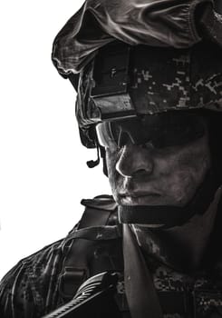 Shoulder portrait of modern army infantry soldier with dirty face in digital camouflage battle uniform, combat helmet, tactical sunglasses looking at camera desaturated, isolated on white background