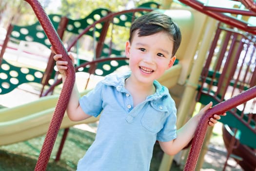 Chinese and Caucasian Boy Having Fun At The Playground.