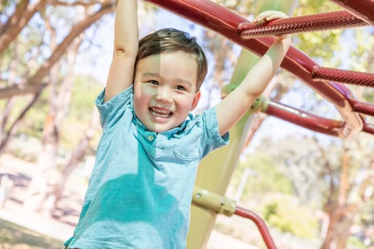 Chinese and Caucasian Boy Having Fun At The Playground.