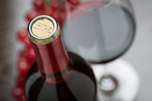 Abstract Wine Bottle, Cork, Glass and Red Grapes.