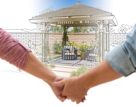 Couple Holding Hands Looking at Design Drawing and Photo of New Yard Pergola.