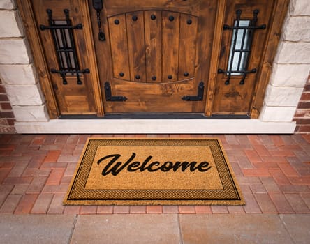 Welcome Mat At Custom Front Door Of House.