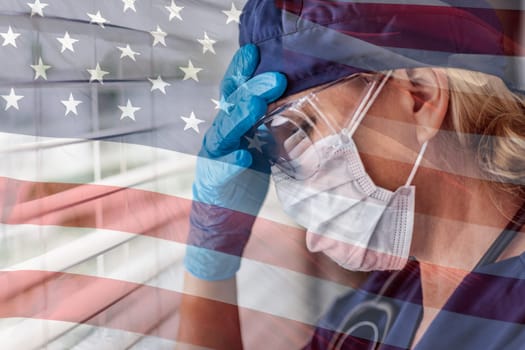 Stressed Female Doctor or Nurse On Break At Window Wearing Medical Face Mask and Goggles With Ghosted American Flag.