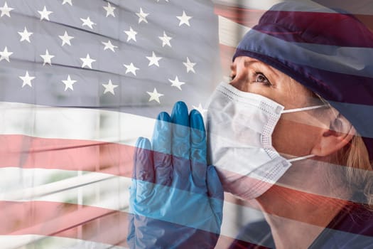 Prayerful Stressed Female Doctor or Nurse On Break At Window Wearing Medical Face Mask.