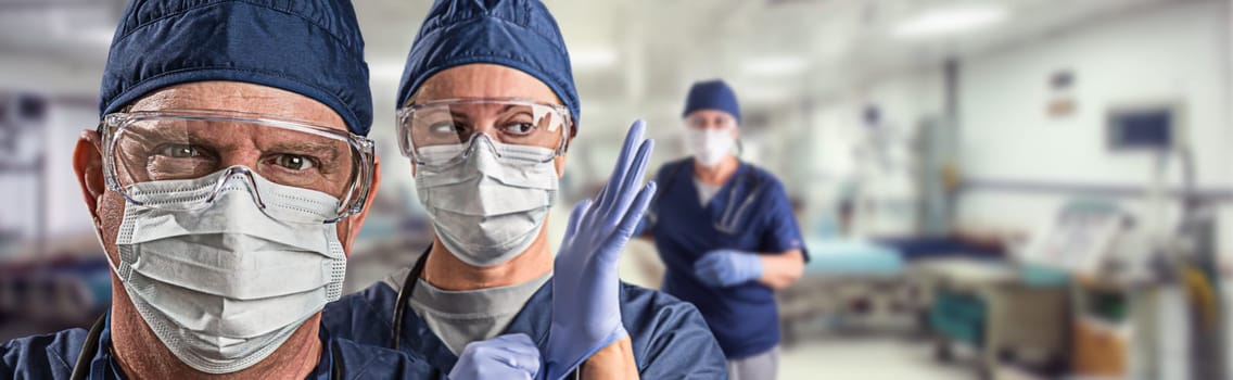 Team of Female and Male Doctors or Nurses Wearing Personal Protective Equiment In Hospital Emergency Room.