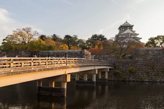 This photo was shot from Osaka Castle, Japan in the evening. The soft sunlight touch the castle is so beautiful.