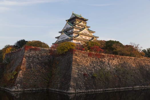 This photo was shot from Osaka Castle, Japan in the evening. The soft sunlight touch the castle is so beautiful.
