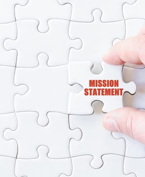 Last puzzle piece with words MISSION STATEMENT. Concept image