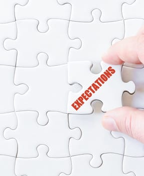 Last puzzle piece with word  EXPECTATIONS. Concept image