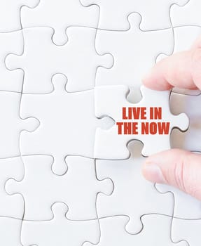 Last puzzle piece with words  LIVE IN THE NOW.  Concept image