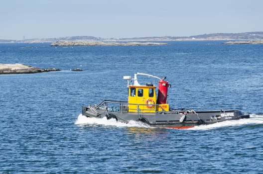 tug boat on the way in water to go to work