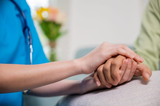 Closeup hand. Young woman helping hold hands offering her senior man, Caring nurse helping elderly old man care gets help from hospital, medical health care, International Day for the Elderly concept