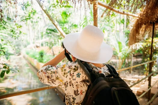Goa, India. Young Backpacker Tourist Photographed Nature In Sahakar Spice Plantation