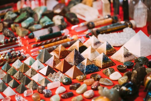 Goa, India. Set Of Indian Chakra Pyramids Made Of Quartz Natural Crystal. Stone Pyramids On Local Goa Market. Popular Souvenirs From India.