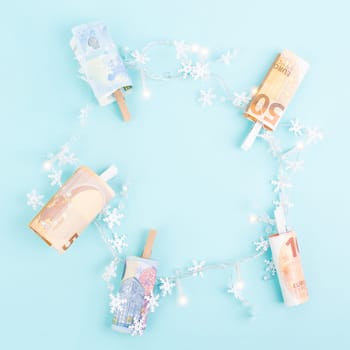 Christmas fairy lights with money, increase of electricity costs, save energy at the holiday season