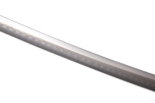 Japanese sword blade (made in China) on white background. Soft focus The blacksmith forged several folds until several layers were formed. Can be seen clearly on the surface.