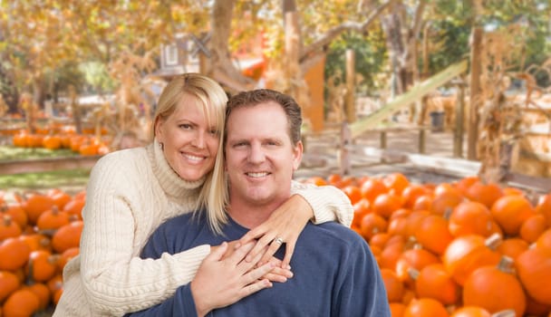 Happy Caucasian Young Adult Couple at the Pumpkin Patch Farm.