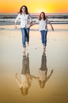 Two Young Sisters Portrait on The Beach.