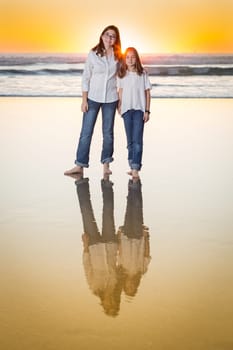 Two Young Sisters Portrait on The Beach.