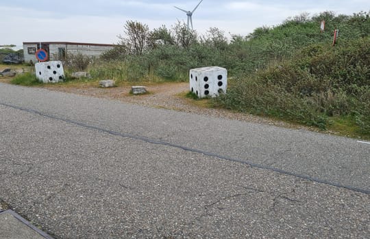 Big white stones, looks like a big white cube with black dots