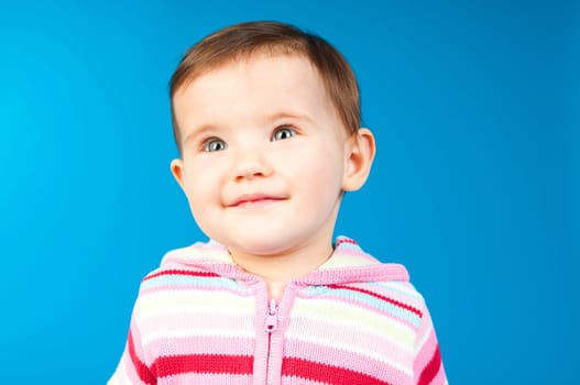 small child isolated on a blue background