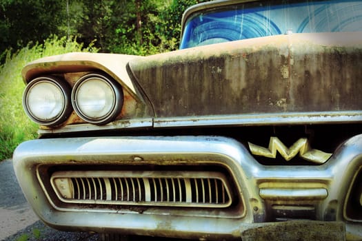 The old rusty car. An old Mercury from the USA