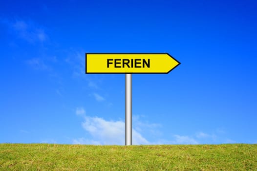 sign signpost on grass against a blue sky showing holiday