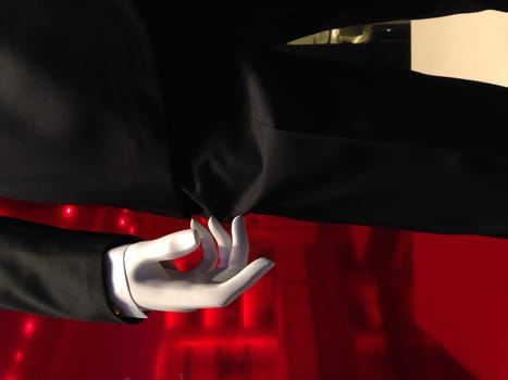 Abstract of Mannequin Hand Standing Wearing Black Suit.